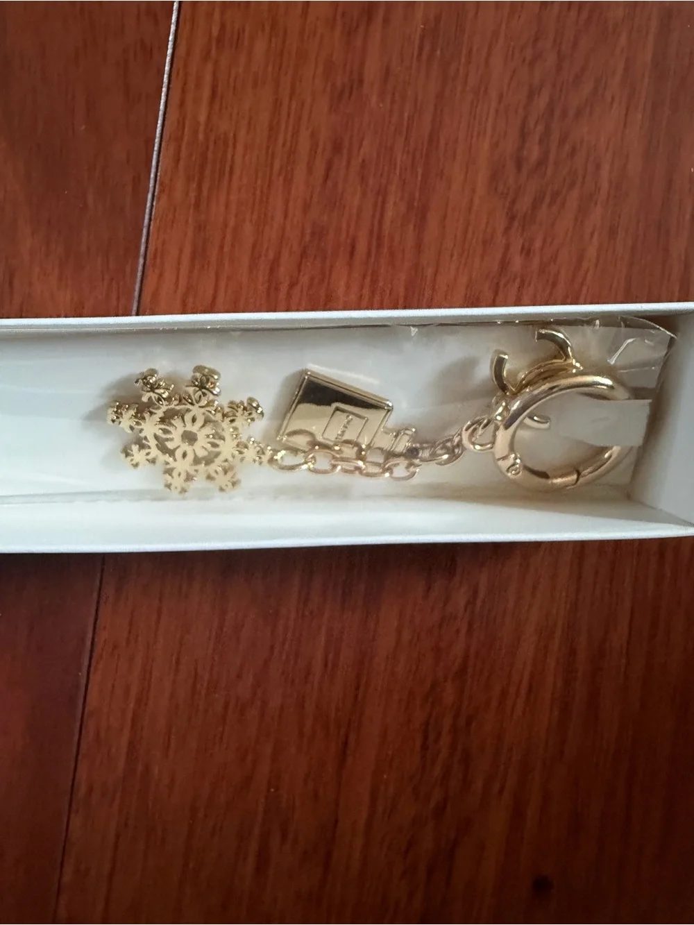 CHANEL Gold Snowflake and Bag Charm Key Ring